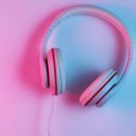 Image of headphones on pink and blue background