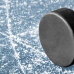 Image of a hockey puck on ice