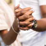 Image of clasped Black hands