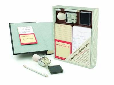 image of a personal home library kit with stamp, book cards, and notepad