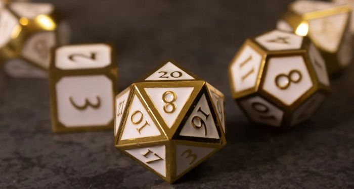 a set of white and gold dice
