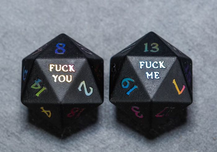 Image of obsidian gemstone dnd dice with holographic number detail, with fuck you for D20 and fuck me for D1