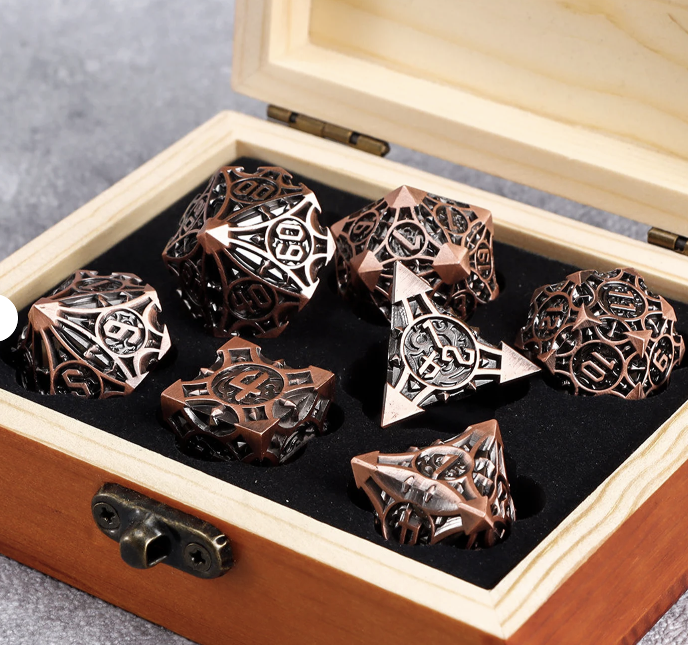 Metal D&D dice, handmade and sitting in a box. 